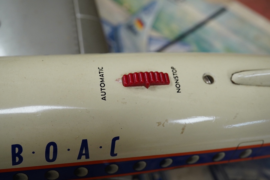 A boxed Schuco Elektro Radiant 5600 battery operated tinplate BOAC passenger aircraft, with instruction leaflet and steering wheel. Condition - poor to good, wear and damage to box and some tape repairs, aircraft general